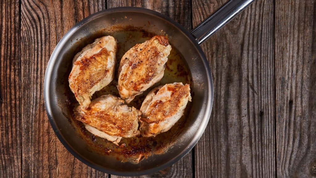 chicken breast on stainless steel pan